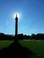 statue on a pole in bright sunshine