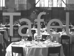 black and white photo of a table in a restaurant