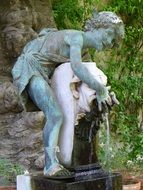 sculpture of a boy with fountain