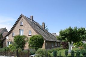 Nice house with thatched roof in the countryside of rugen island