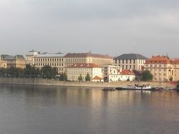 historic buildings on the banks of the Vltava river in Prague