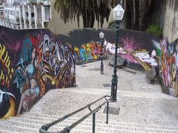 graffiti on the walls along the city stairs