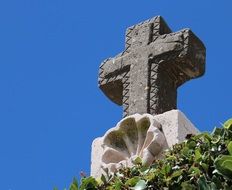 stone christian cross as a sculpture