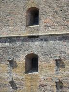 stone window in the ancient wall