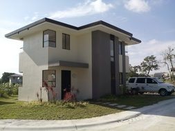 a car is standing near the house