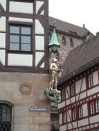 golden statue on the facade in Nuremberg