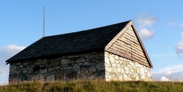 stone old building on a rural field