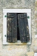old destroyed wooden shutters on window