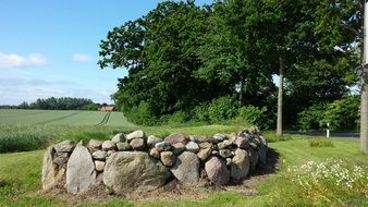 flowerbed of stones on the road