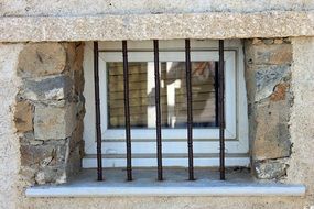 barred window of an old house