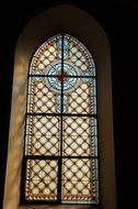 colorful church window stained glass in light and shadow