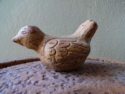 sculpture of a bird in the garden