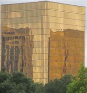 building reflection on golden facade
