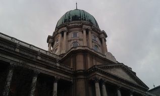 big castle dome in Budapest, Hungary at cloudy weather background