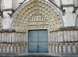 cathedral doors with ornate carvings on it