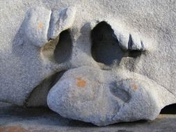 stone sculpture in the form of a face