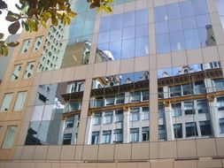 mirror reflection of the house in the facade of the building