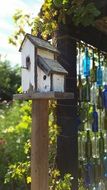 rustic birdhouse on pole