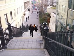 Photo of people climbing stairs