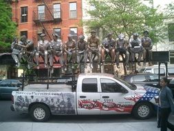 Iron workers sculpture by Sergio Furnari on truck, usa, manhattan, nyc