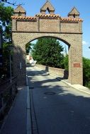 medieval city gate in front of the bridge, germany, bavaria