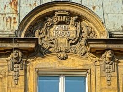 relief artwork on the facade of the building