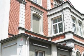 old building with large windows close-up