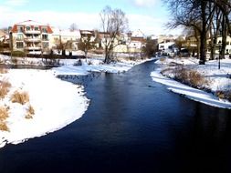 bright winter landscape, old town at river