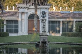 Palace near a pond in a park in Madrid