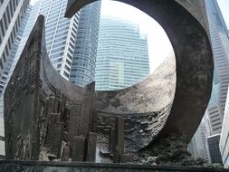 modern sculpture near the skyscrapers in singapore