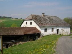 Photo of a rural house with a barn