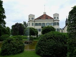 green trees near the mansion