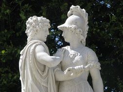 white sculpture in the park on a sunny day