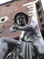 Sculpture of an ancient god playing the musical instrument