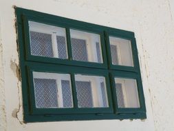 window with white frame on a white wall close-up