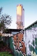 tower behind the wall with graffiti