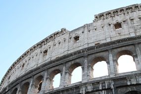 Colosseum in Rome against the background of clear sky