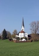 white church on a green grass