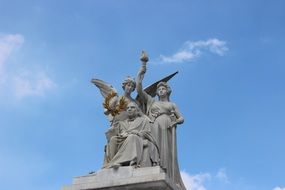 sculptures of angels against the sky