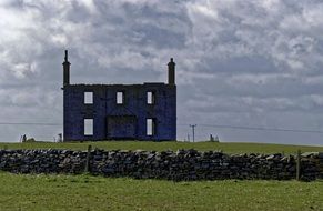 abandoned ruins in a field