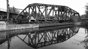 black and white photo of an iron bridge