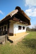 house near green grass in the village