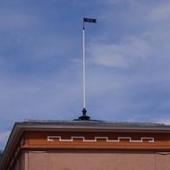 Finnish flag on the roof of the building