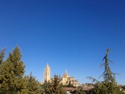 cathedral among green trees in spain, segovia