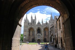 view of the cathedral through a stone arch