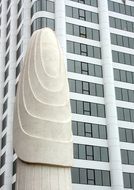 white sculpture near the white building in Los Angeles