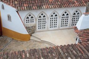 house arch grated windows, portugal, obidos