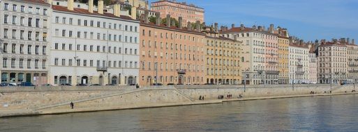 old apartment buildings on embankment, france, lyon