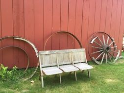 wooden bench against the background of the pink wall on the ranch