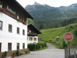 restaurant at road in alpine mountains